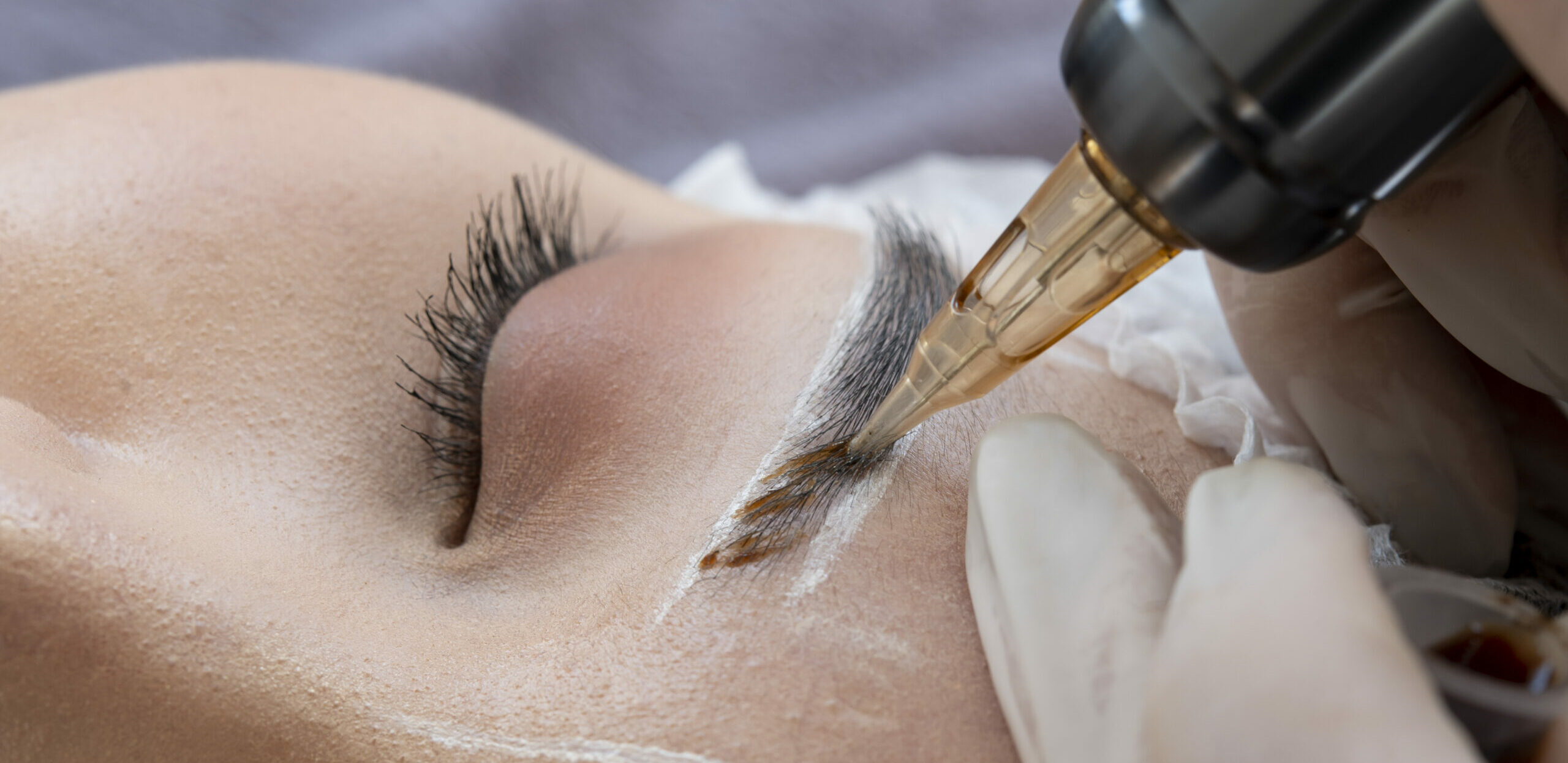 beautician-doing-microblading-procedure-client-s-eyebrows